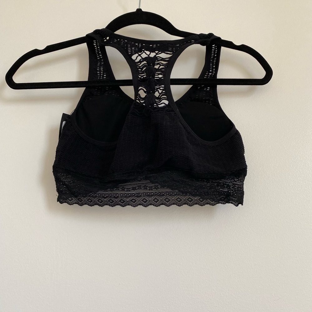 NEW. Tags on. Bralette. Size M. Black with details in the back.